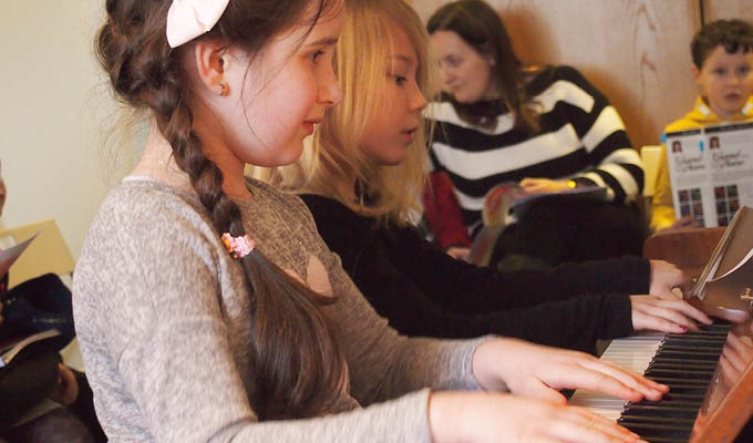 Students at the Colourful Keys Piano Studio playing a duet